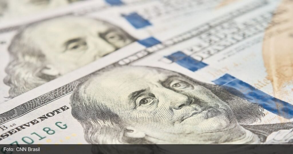 Graficos economicos ilustrando queda do desemprego no Brasil em 2026
